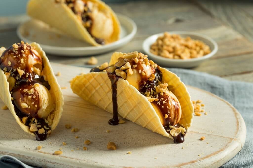 Ice cream tacos with the chocolate spread pour all over it